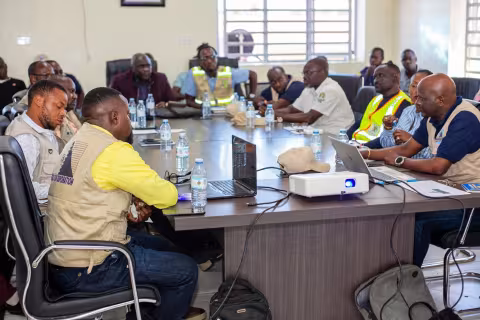 Stakeholders at the site handover meeting for the new Mahagi-Goli bridge